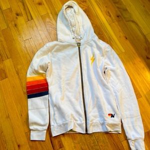 this aviator nation zip up sweatshirt is a woman size medium.